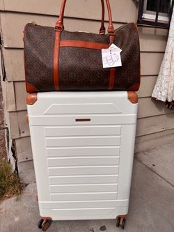 travel bag and a rolling luggage suitcase