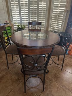 Counter height, pub table with matching upholstered chairs