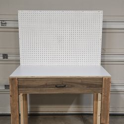 Custom-made workbench with peg board and soft closing drawer