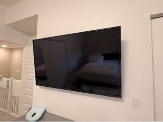 50” TCL Roku Smart TV – Wall Mounted – Includes Remote
