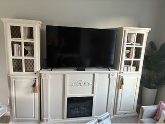 Fireplace with side cabinets.
