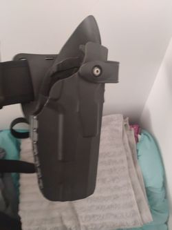 Gun holster and hand cuff key