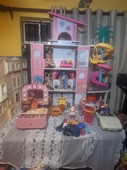 Barbie Doll House And Many Different Excessories Including Some Clothes 