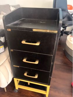Rolling on wheels cabinet with drawers