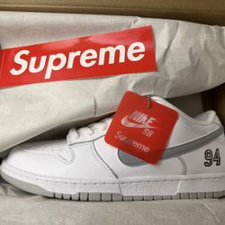 Nike Dunk SB x Supreme “White Metallic Silver”