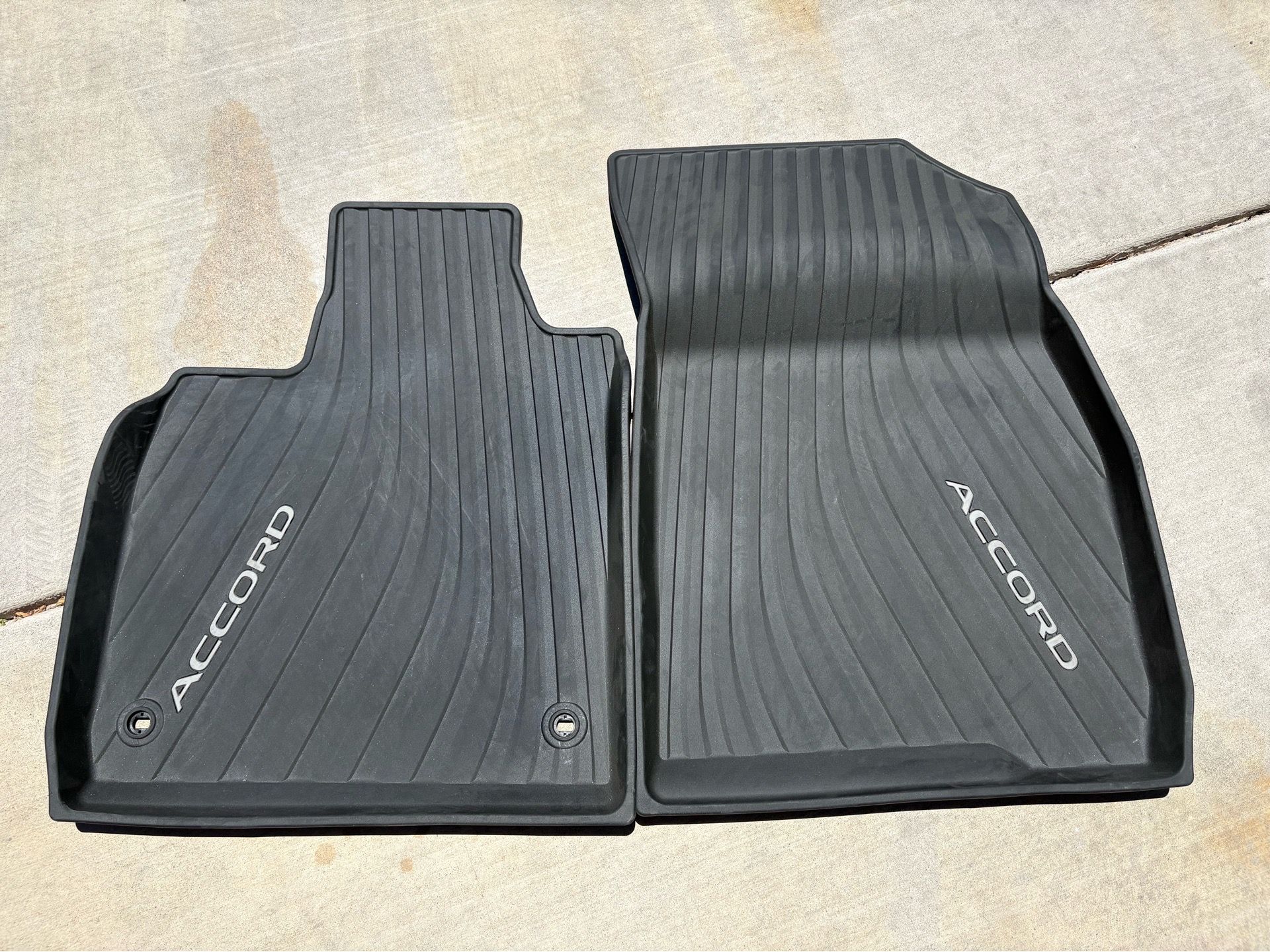 These are genuine OEM Honda Accord all-season floor mats designed for the front driver and passenger sides