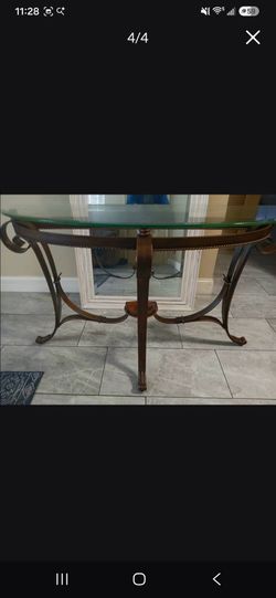 Glass Top decorative table.$60 OBO BASE IS METAL WITH COPPER FINISH