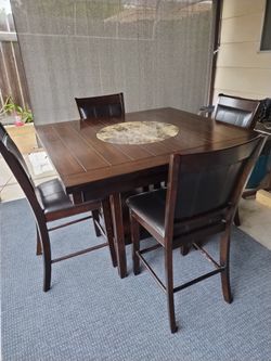 Square Countertop height Table with Lazy Susan and 4 padded chairs