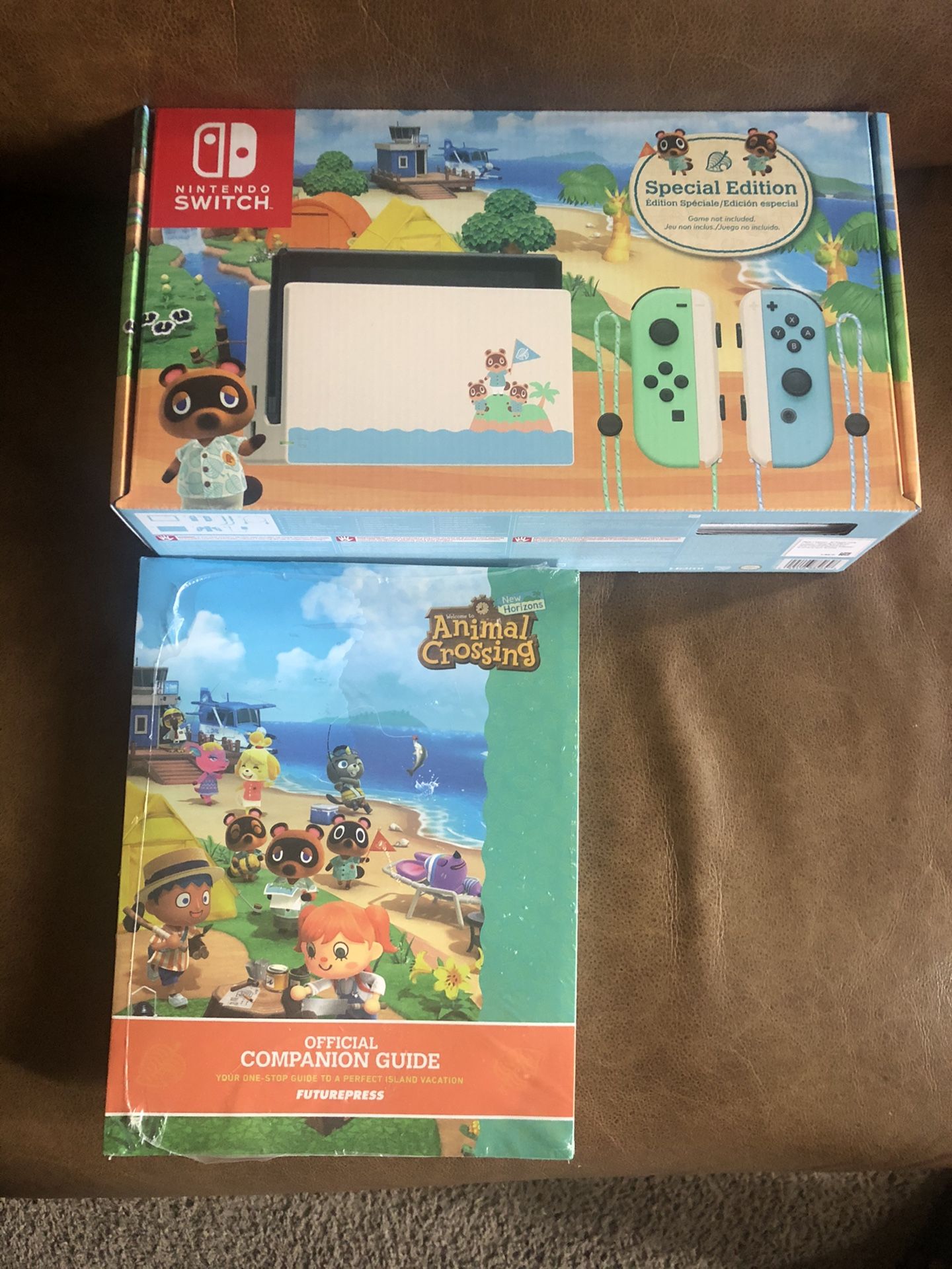 Nintendo switch Animal Crossing edition with official companion guide. (Brand New)