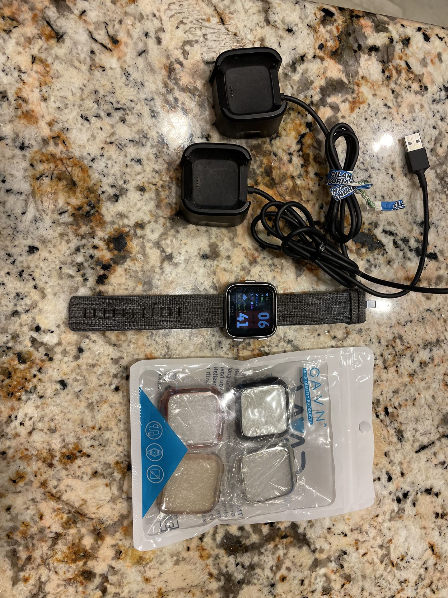 Like new - Fitbit Versa Special Edition. Comes with bonus screen protectors/watch faces plus 2 chargers. Works great. 