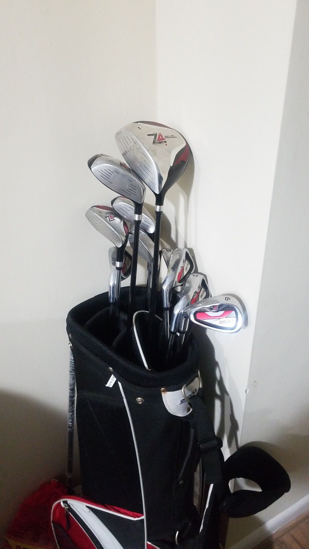 Golf Clubs and Bag of Golf Balls