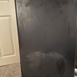 Black Haier mini fridge