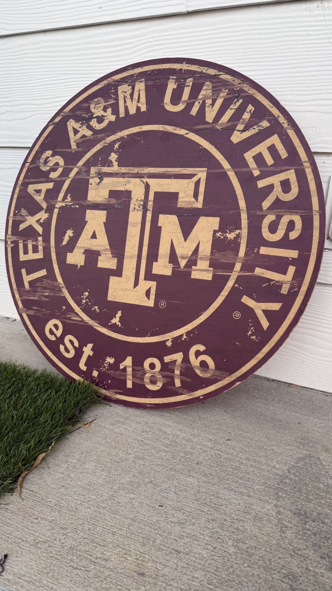 Rustic Texas A&M University round wooden sign