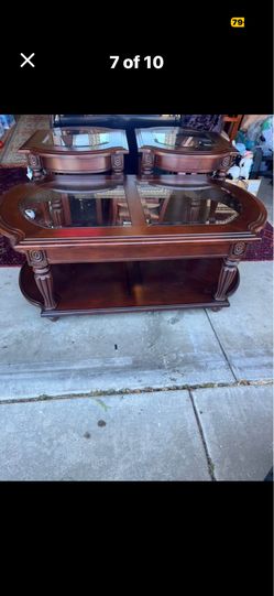 Three piece, coffee table, top glass condition good hundred percent wood