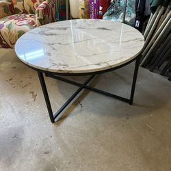 Coffee Table. Barely used. Black cross legs with faux marble top. 36”