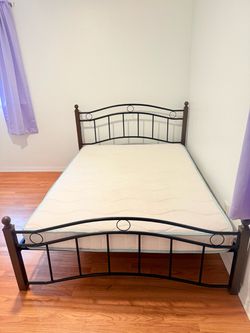 Full Sized Black and brown metal bed frame