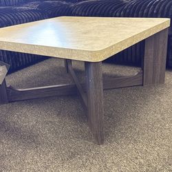 3 pc coffee and end table set by Ashley furniture