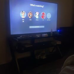 Roku 55’ Tv And Black Tv Stand 