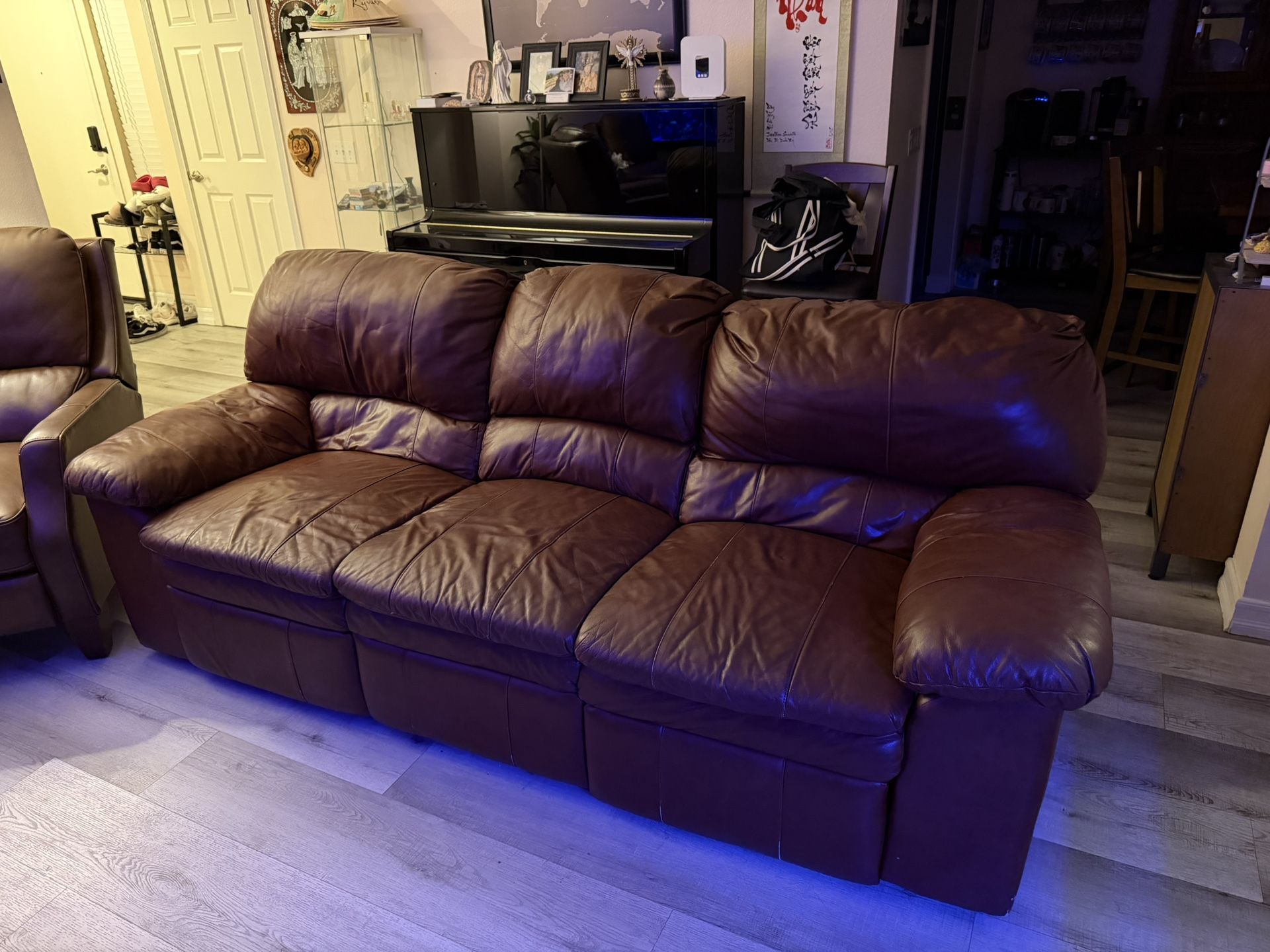 Brown Leather Sofa With Dual Recliners.
