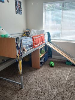 Loft bed with slide and shelf