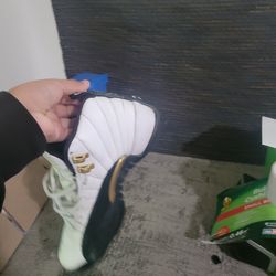 Jordan 12s black and white and gold