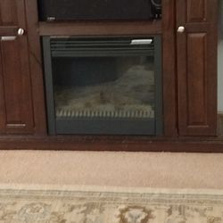 TV Stand. Wood Two Doors On The Side Of The Storage The Fireplace Has A Needs A New Switch 