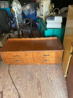 A wood chest it’s 16 inches tall 48 inches wide and 18 inches deep