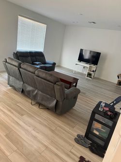 Gray Reclining Sofa and Loveseat Set