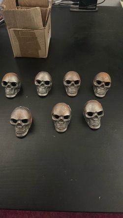 Set of 7 Cast Iron Skull Figurines