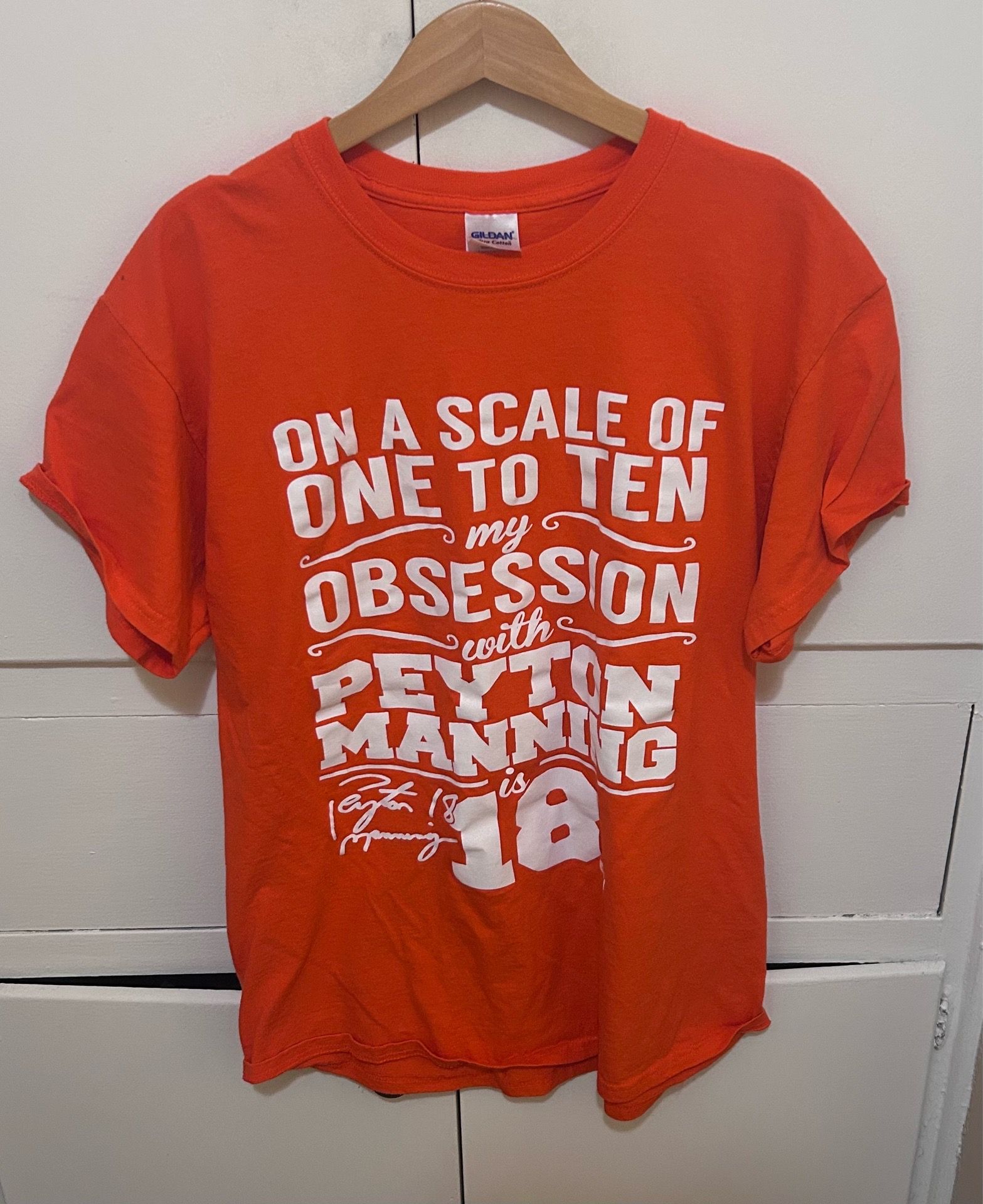 Peyton Manning shirt size mens large. Stain on sleeve shown