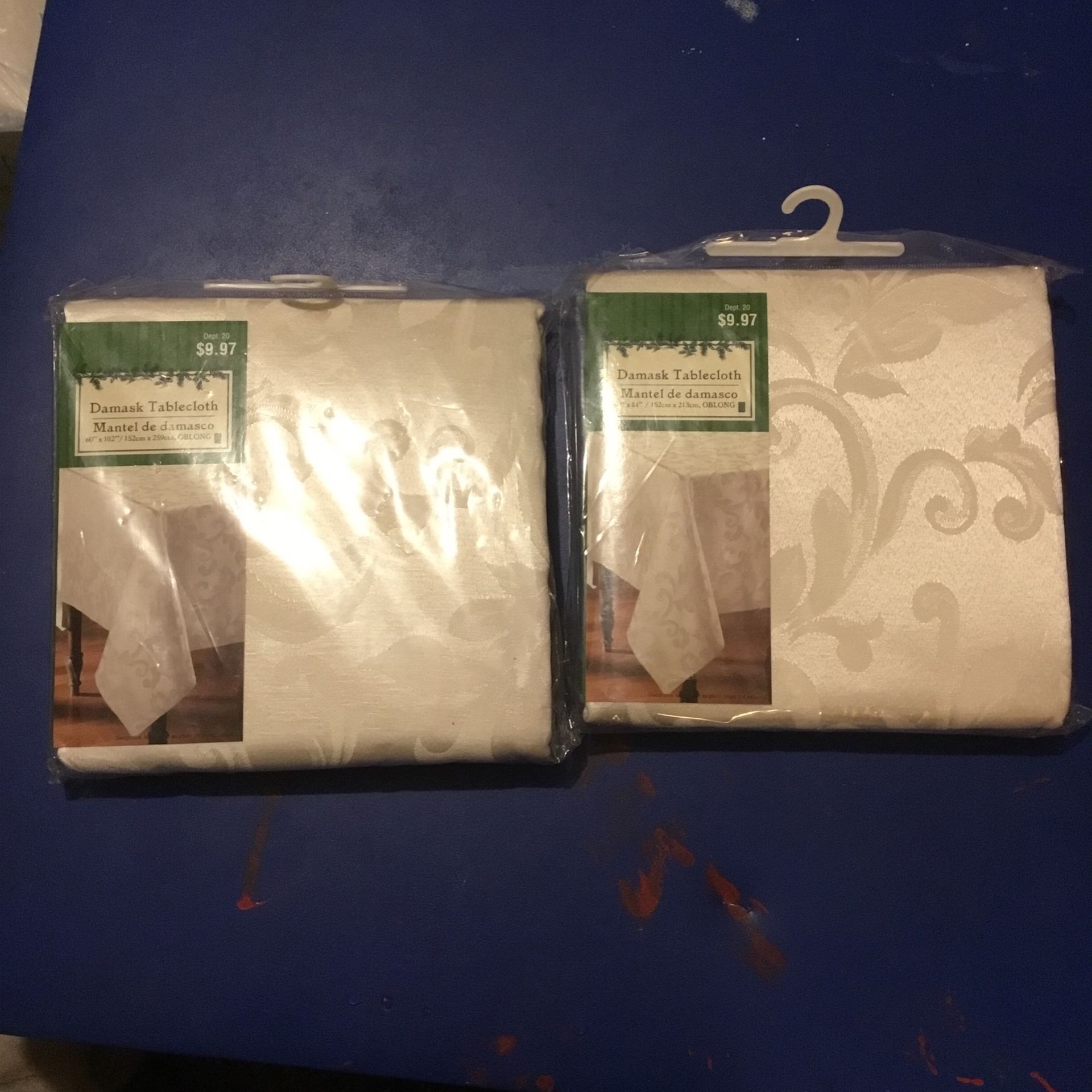 2 Damask Tablecloths 1 Is 60” X 84” 1 Is 60” X 102” NEW IN PACKAGES