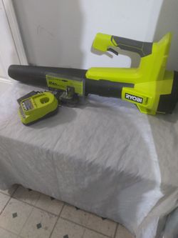 RYOBI + 18V 90 MPH 250 CFM Cordless
Battery Leaf Blower/ Sweeper Whit 2.0 Ah Battery  and Charger 
NEW