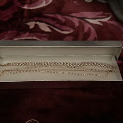 Two bracelets and one ring