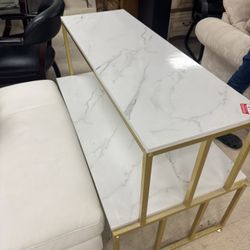 modern two-tier console table with a gold-colored frame and faux white marble shelves - 44” x 24”