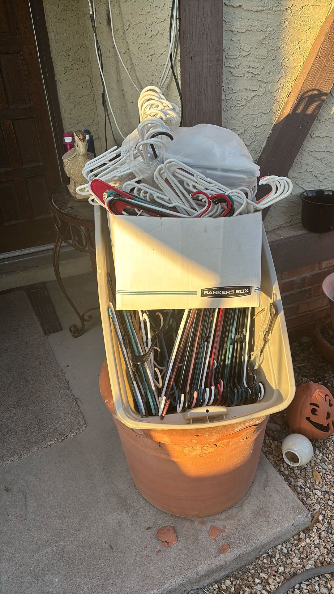 12 dozen plastic clothes hangers