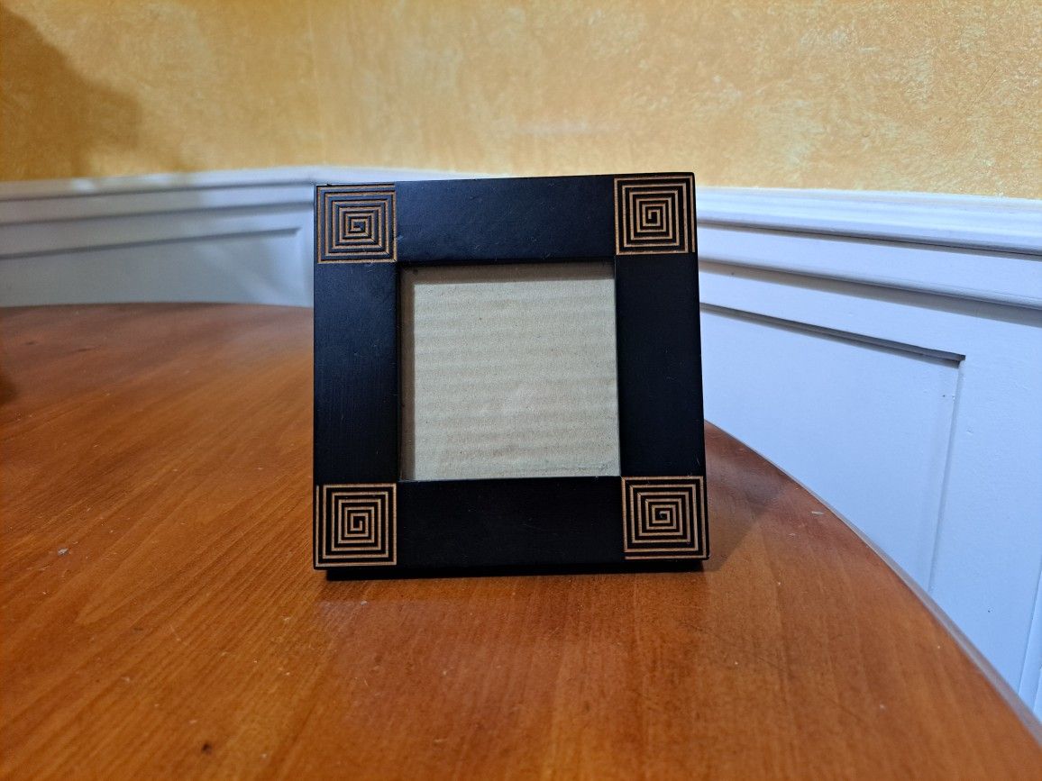 Black picture frames 5 1/2 square, picture size 3 square.