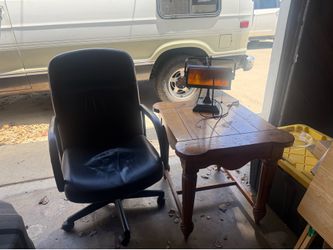 Office chair. Coffee table and metal lamp