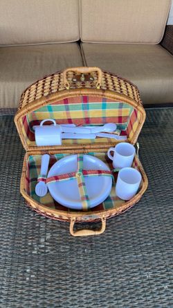 Vintage picnic basket with plates cups cutlery