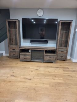 Ashley Furniture "Trinell" 3-Piece Entertainment Center with Electric Fireplace & Lighted Piers
