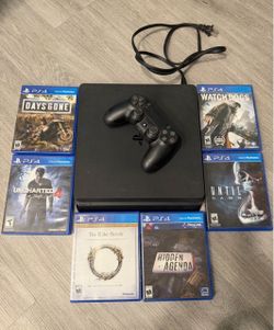 PS4 with controller & games