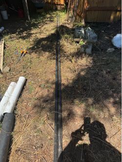 2- 20 foot black metal poles from chain link fence.