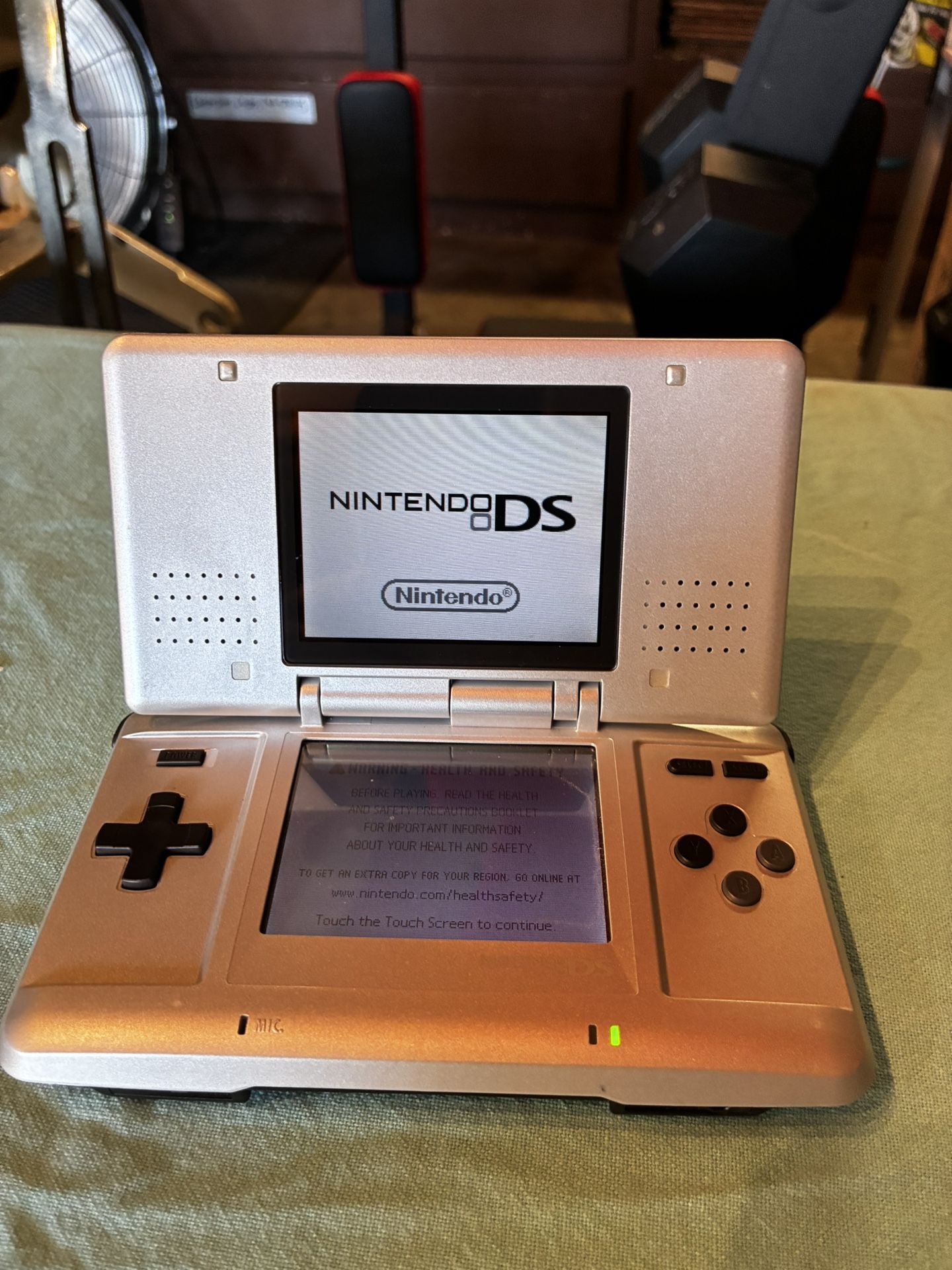 Nintendo DS with three games