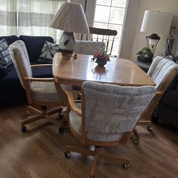 Dinning table, chairs and a lamp