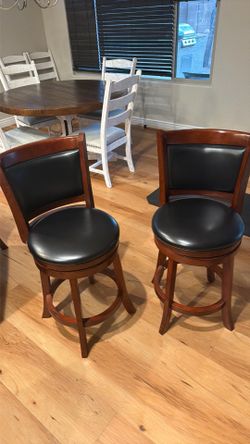 4 Swivel Wood Bar Stools.  100.00OBO.