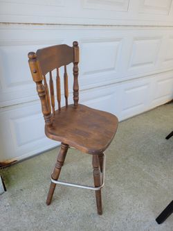Solid Wood Swivel Barstool With Metal Footrest. Older Stool But Works Great.
