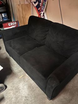 Small black loveseat