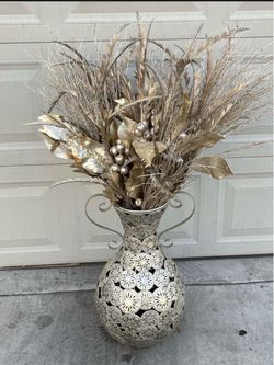 Gold faux flower arrangement with metal vase
