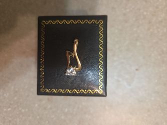 14 k gold pendant.  Weight is 1.4 grams