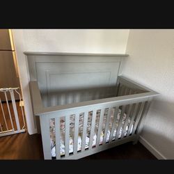 Grey baby crib