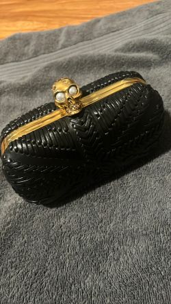 Alexander McQueen Brittania Skull Box Clutch featuring a prominent gold-tone skull clasp
